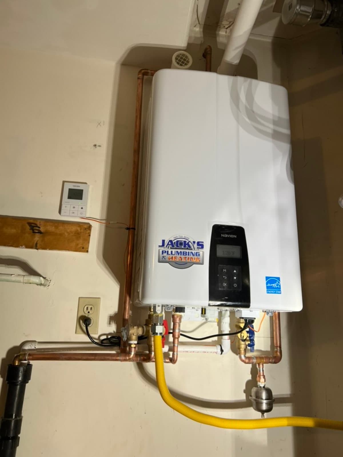 NAVIEN tankless water heater with controller and copper piping installed by Jack's Plumbing