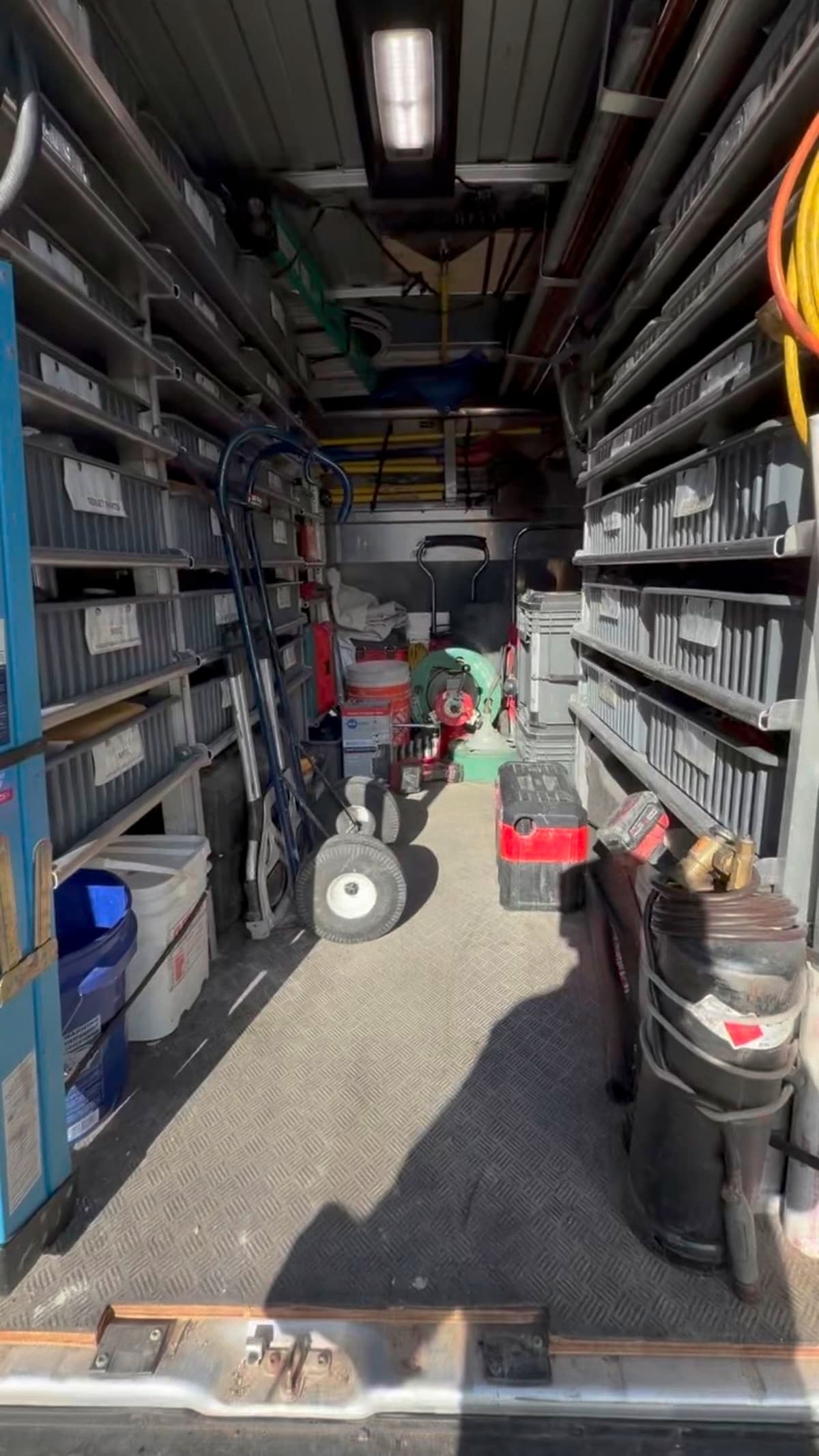 Fully stocked Jack's Plumbing service van with organized parts and tools