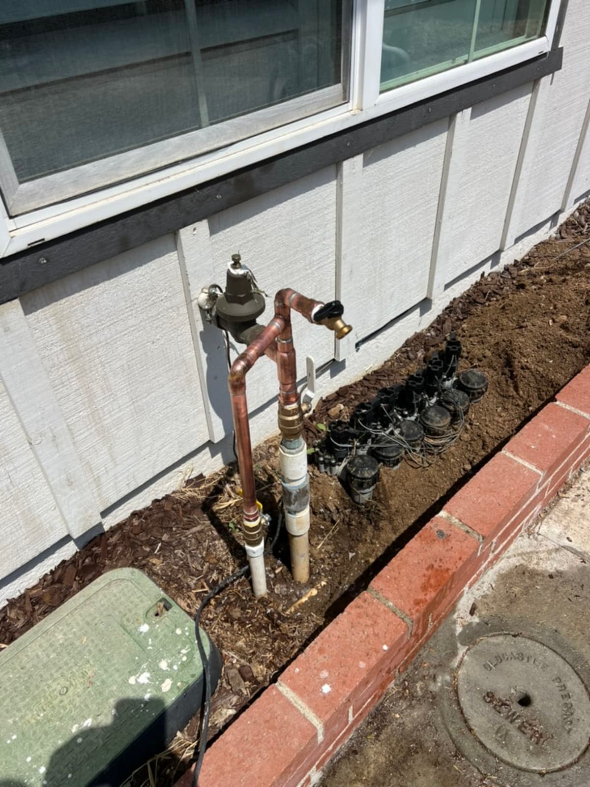 Copper water service with pressure reducing valve, hose bibs, and irrigation connection
