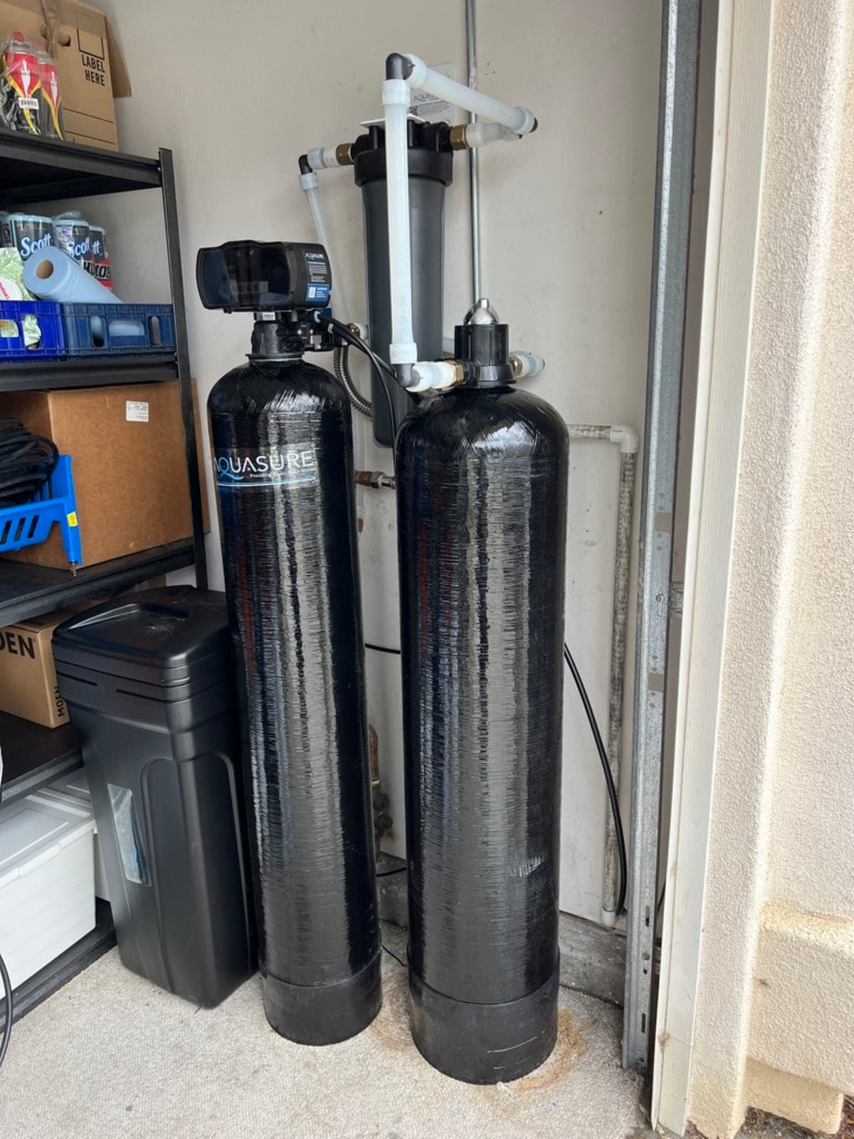 Aquasure dual-tank water softener and filtration system installed in Carlsbad garage